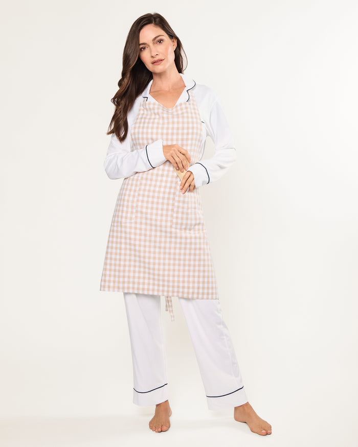 The Adult's Twill Apron in Camel Gingham features a beige and white checkered pattern, a neck loop, front pockets, and waist ties, shown laid flat on a white background.