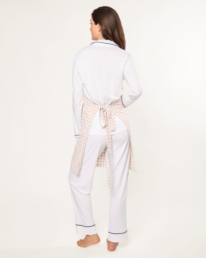 The Adult's Twill Apron in Camel Gingham features a beige and white checkered pattern, a neck loop, front pockets, and waist ties, shown laid flat on a white background.