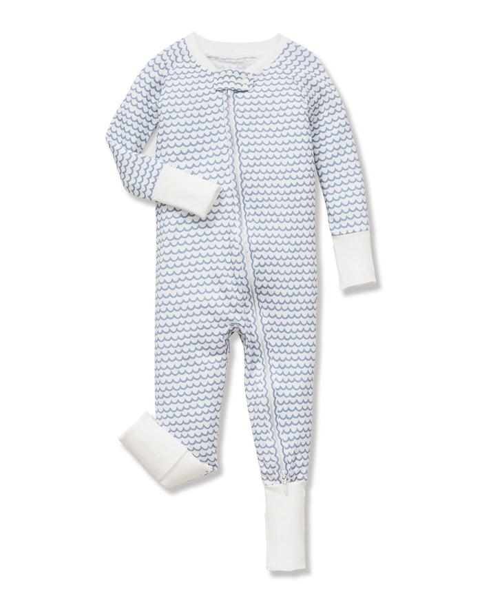 The Baby's Pima Peekaboo Romper in La Mer features a blue wave pattern, white cuffs on the sleeves and legs, and a diagonal zipper from the neckline to the left ankle.