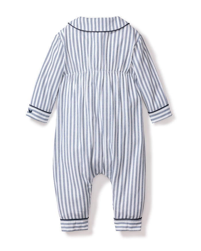 Back view of the Petite Plume Babys Twill Cambridge Romper in Navy French Ticking, featuring blue and white vertical stripes, a collar, cuffed sleeves and ankles with dark trim. Made from soft brushed twill fabric, its ideal for cozy sleepwear.