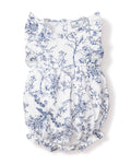 The Babys Twill Ruffled Romper in Timeless Toile by Petite Plume is a white romper with blue floral and botanical prints, ruffled sleeves, a cinched waist, and elastic leg openings for a gathered, airy look.
