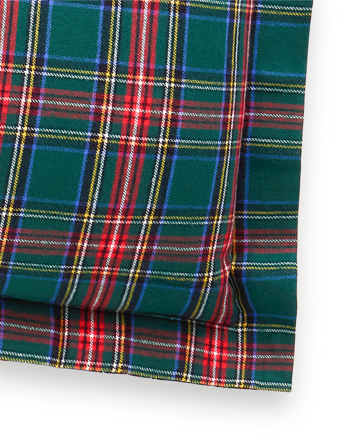 The Flannel Euro Sham in Kensington Tartan features a square shape with a green, red, yellow, and white tartan plaid pattern on a white background.