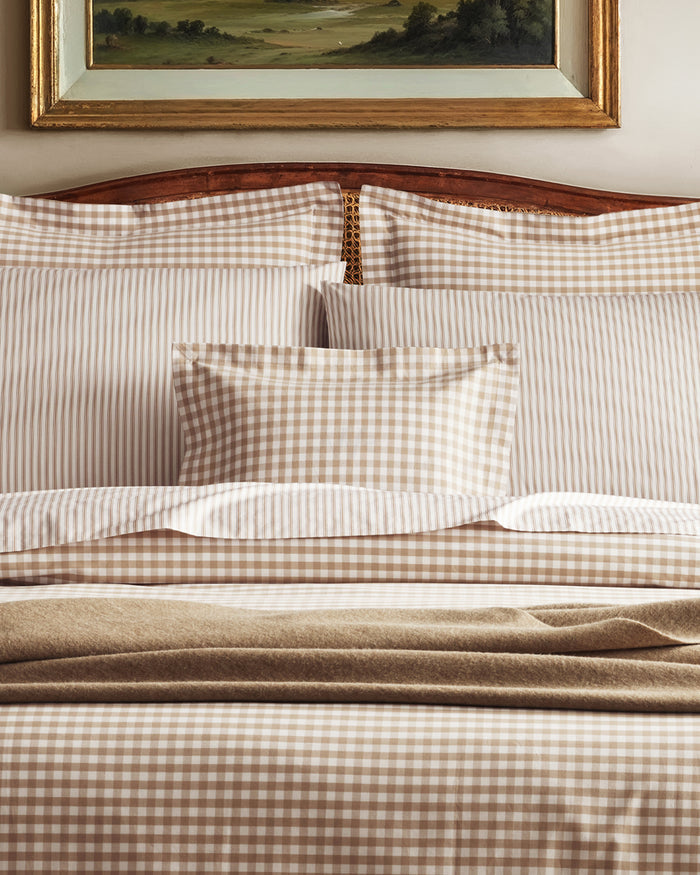 The Luxe Premium Percale Decorative Pillow in Camel Gingham features a beige and white checkered pattern with a flange edge, displayed against a white background.