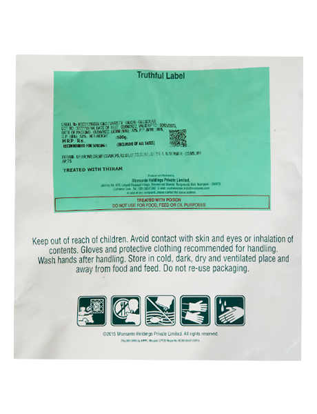Close-up of a seed packaging back label with a green Truthful Label sticker, safety warnings, and pictograms. (116 characters)