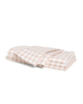 A neatly folded set of Signature Twill Napkins in a camel and white gingham checkered pattern, displayed on a white background.
