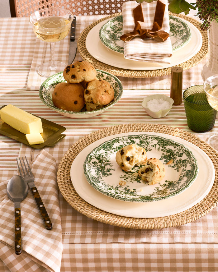 A neatly folded set of Signature Twill Napkins in a camel and white gingham checkered pattern, displayed on a white background.