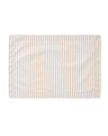 A Signature Twill Placemat in Camel Ticking, featuring light brown and white vertical stripes, is neatly laid flat on a white background.