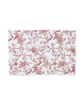 The Signature Twill Placemats in Red Timeless Toile feature a detailed red floral and bird toile design on white, neatly displayed against a plain background.
