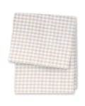 A folded Signature Twill Table Runner in Camel Gingham, featuring a beige and white gingham pattern, displayed on a white background.