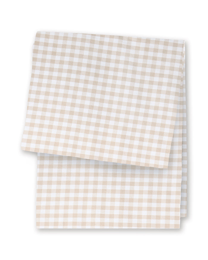 A folded Signature Twill Table Runner in Camel Gingham, featuring a beige and white gingham pattern, displayed on a white background.