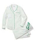The Womens Twill Pajama Set in Match Point by Petite Plume features high-quality cotton with a white base and small green floral pattern. The collared top includes a single chest pocket with green piping, while the pants feature a drawstring, all presented on a light background.