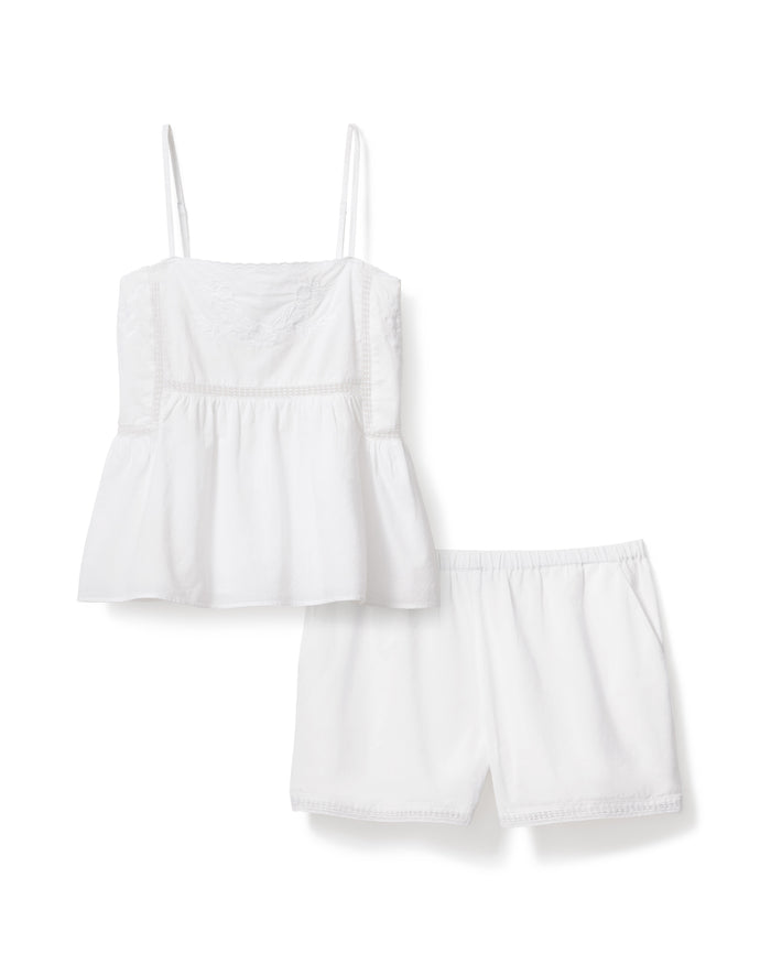 A woman with wavy, light brown hair wears the Women's Voile Luna Cami Short Set in White, standing against a plain light background.